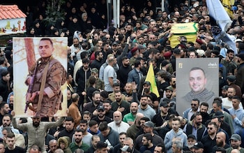 Mourners carry the coffin of late Hezbollah commander Ali Ahmed Hussein during a funeral procession in Beirut, Lebanon